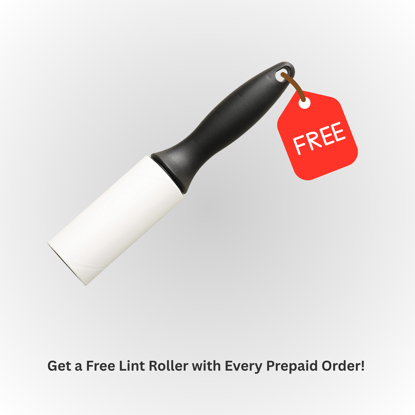 White lint roller with black handle and red 'FREE' tag on a light gray background