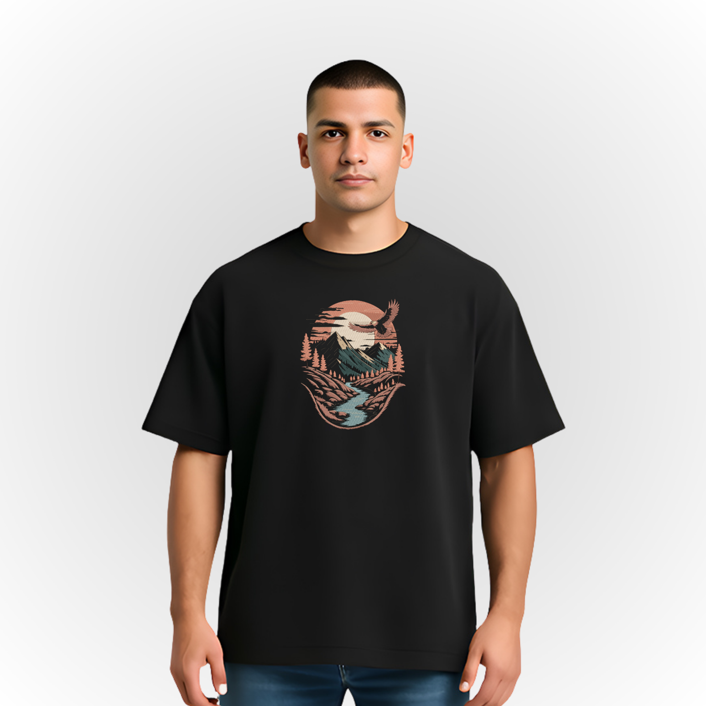 Person wearing a black t-shirt with a mountain river landscape on a white background