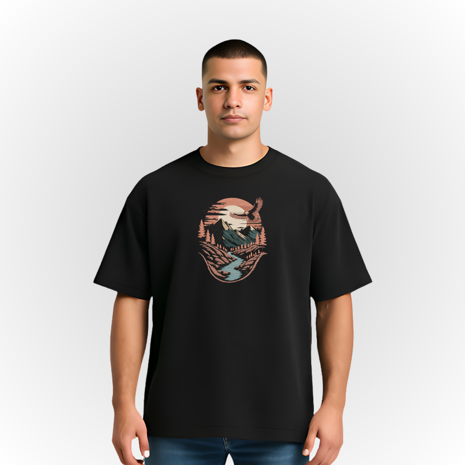 Person wearing a black t-shirt with a mountain river landscape on a white background