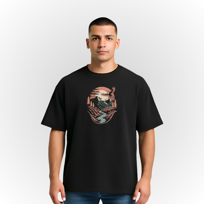 Person wearing a black t-shirt with a mountain river landscape on a white background