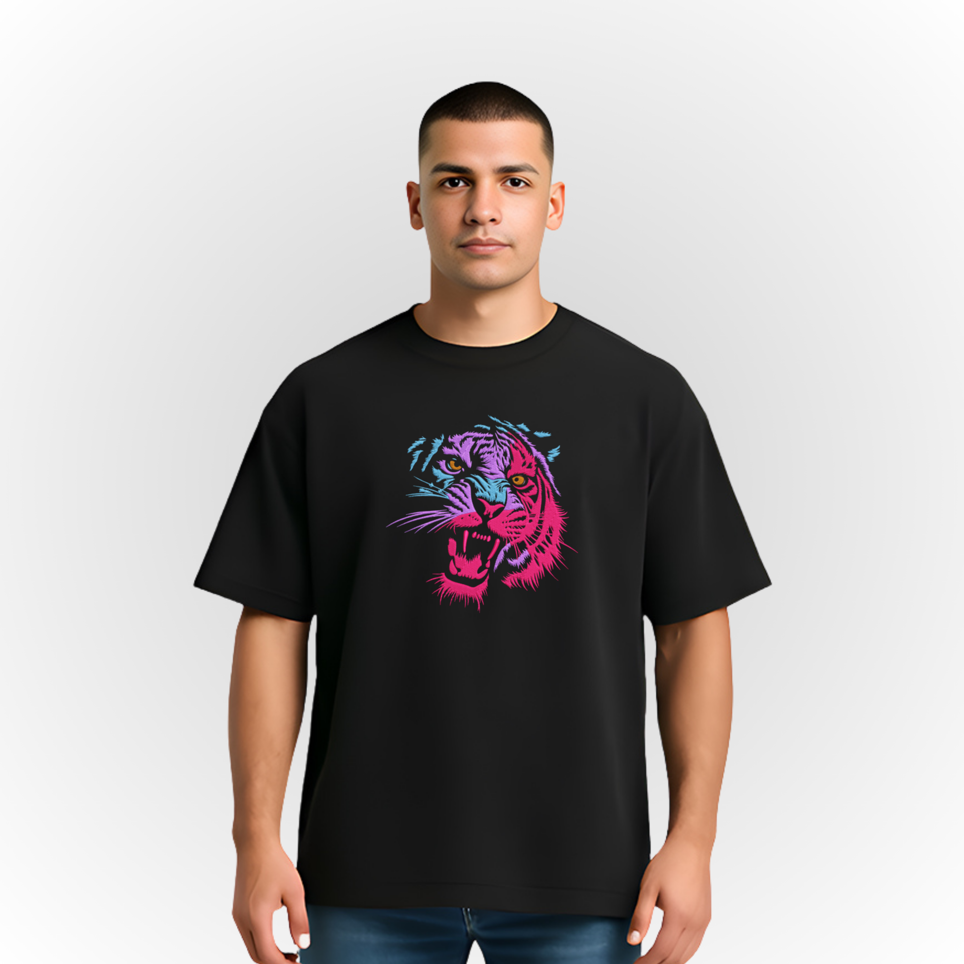Person wearing a black t-shirt with a multicolor roaring tiger embroidery on a white background