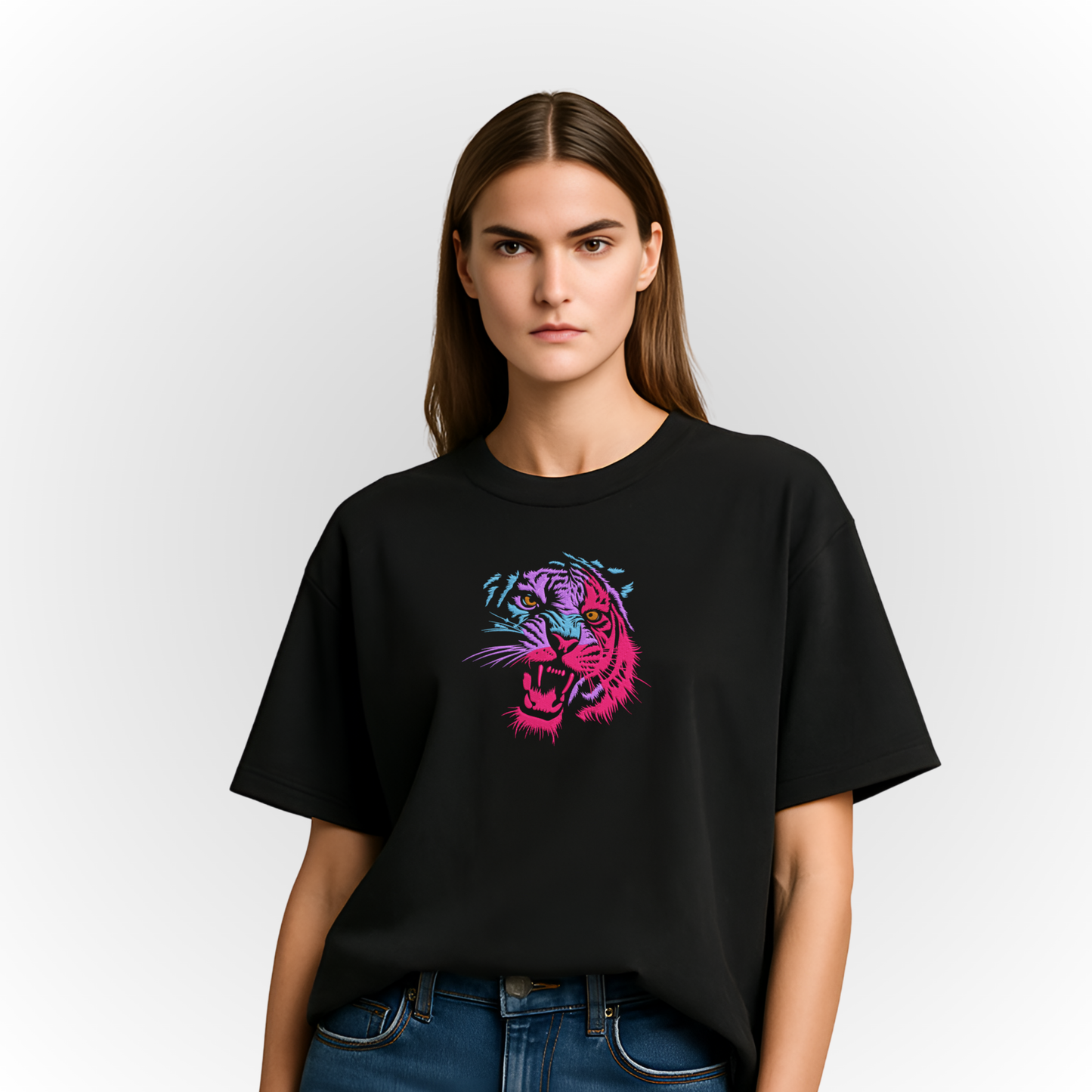 Person wearing a black t-shirt with a multicolor roaring tiger embroidery on a white background